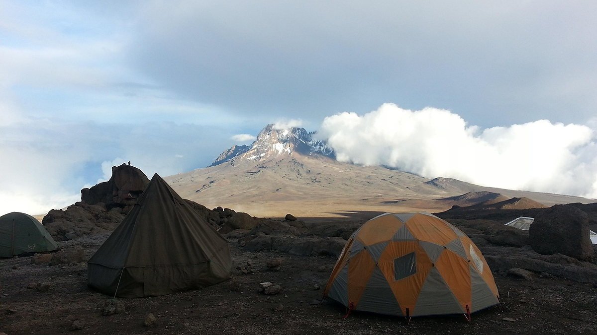 Climbers camp below the jagged Mawenzi peak, Kilimanjaro